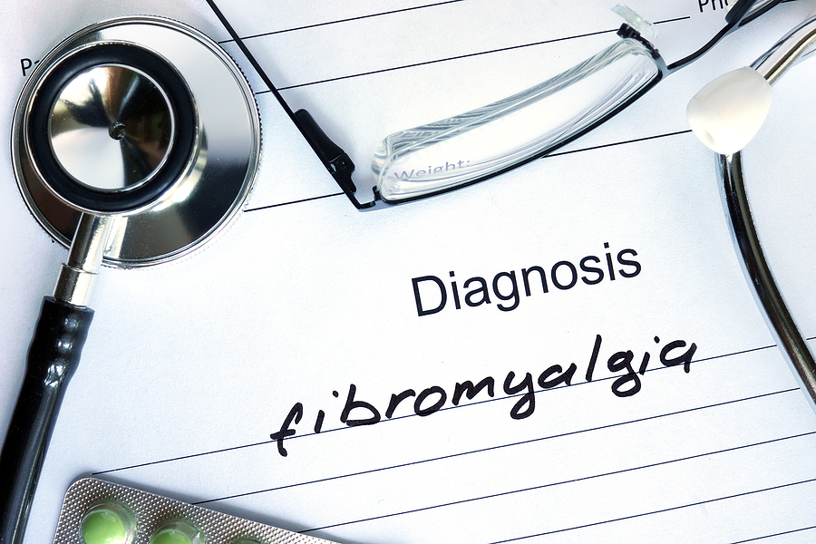 What causes fibromyalgia explained on a medical diagnostic form with fibromyalgia written as the diagnosis